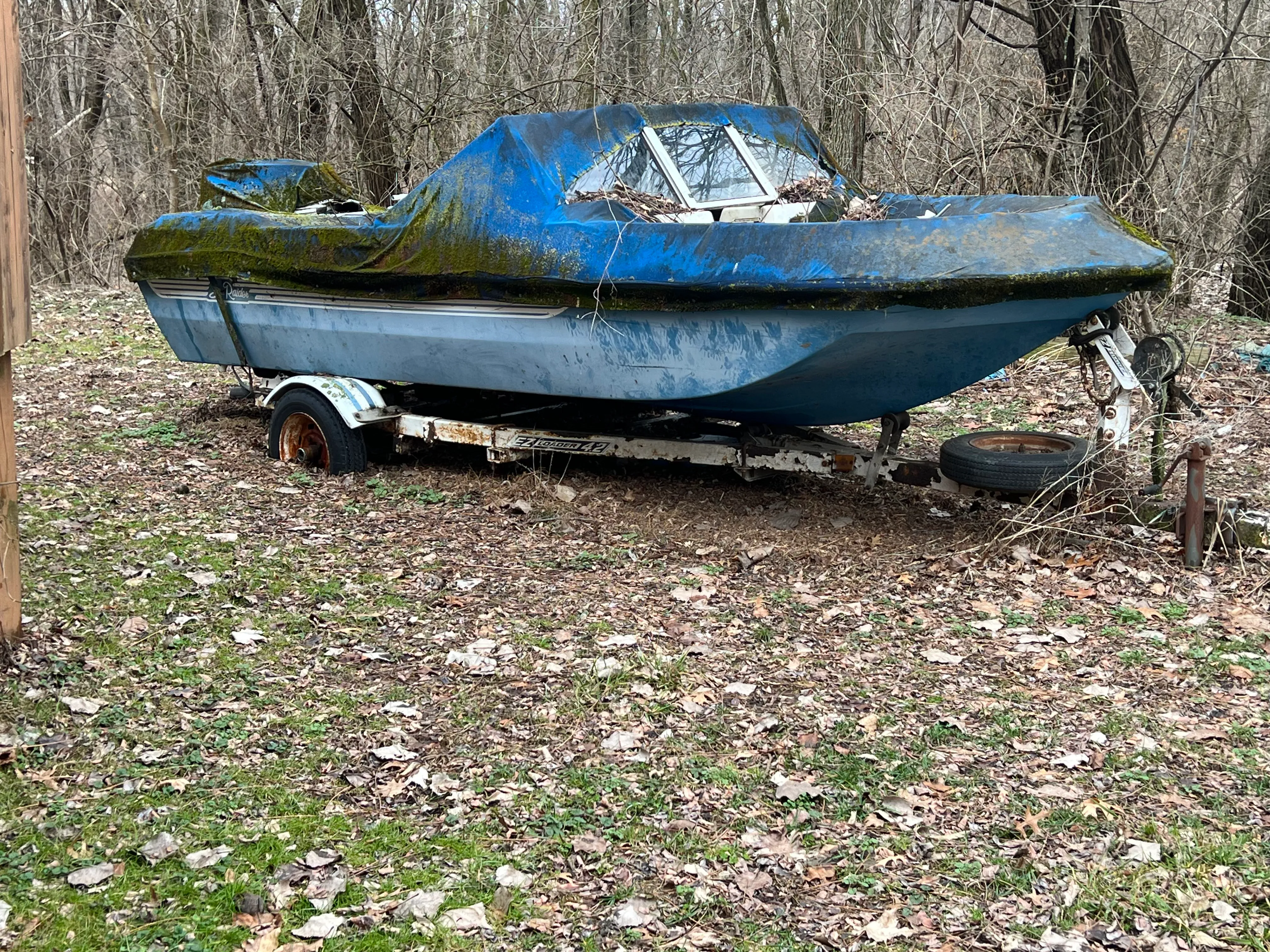 Boat at marina dock staged before scheduled haul-out and transport