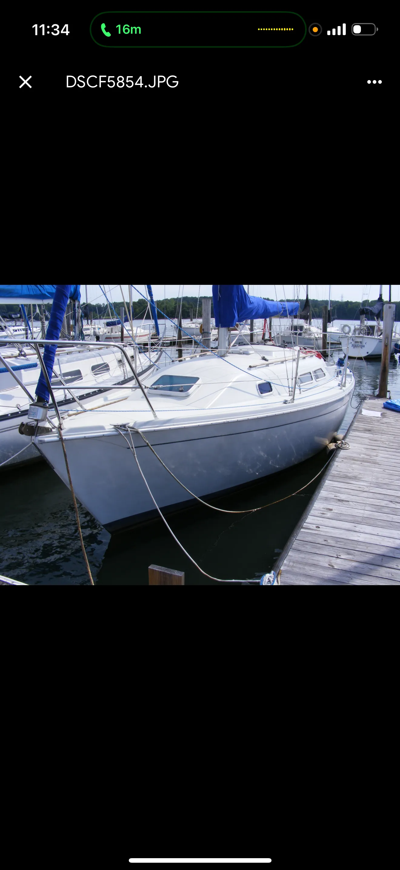 Sailboat moored at a marina waiting for haul-out and removal