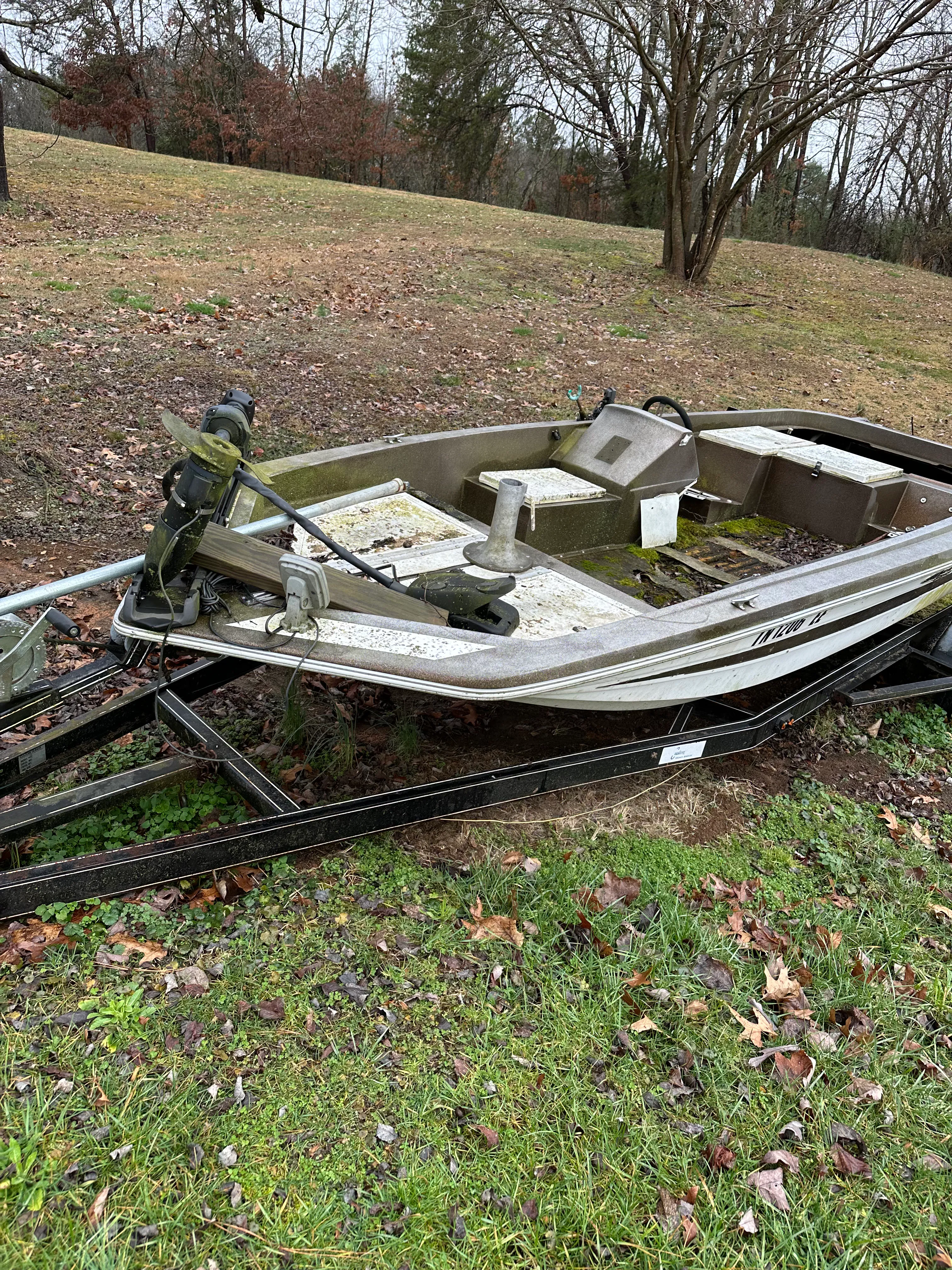 Stripped boat hull interior prepared for final cleanout and disposal